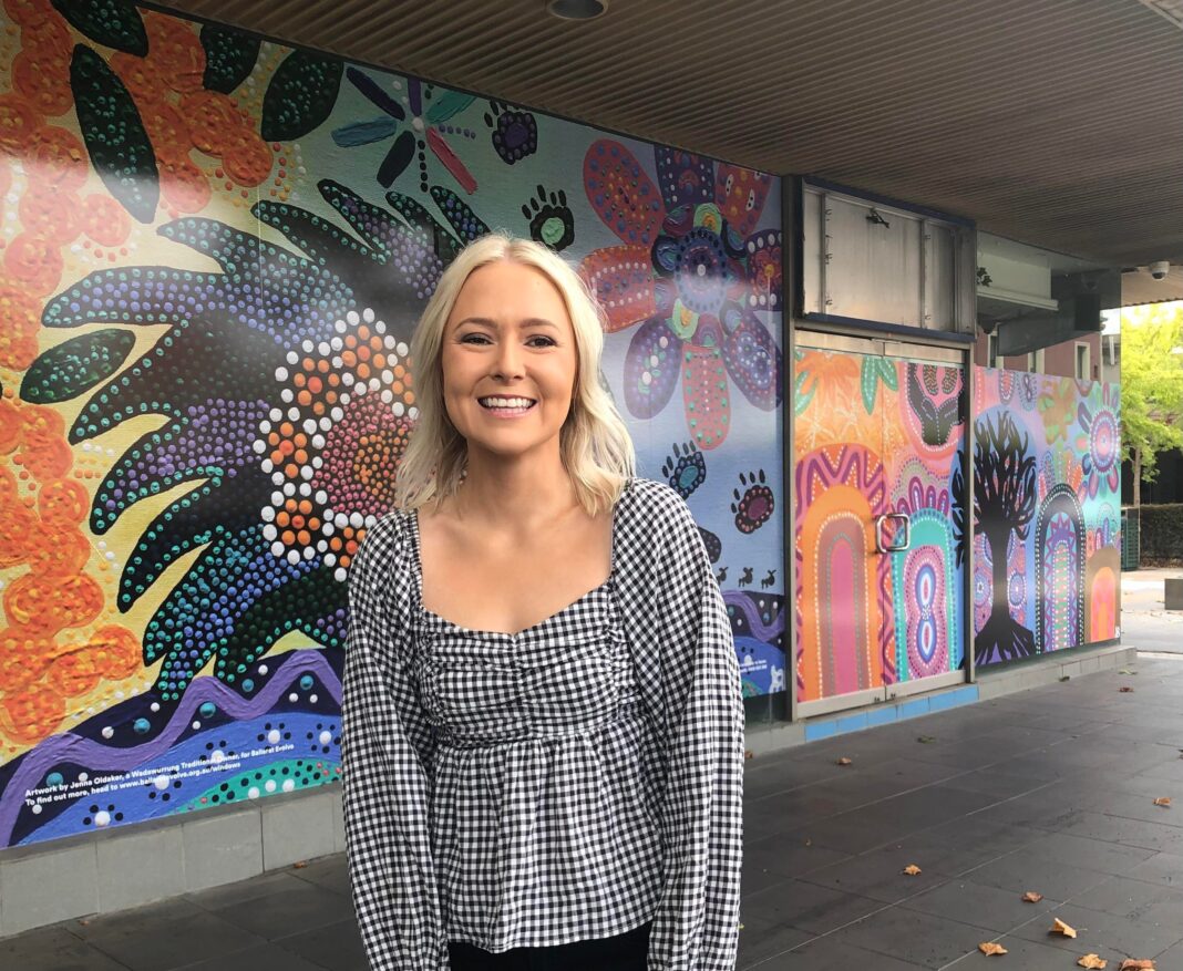 Jenna Oldaker with artwork for Ballarat Evolve scaled